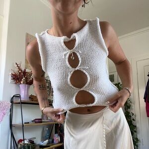 White handmade crochet cut out tank top with heart charm in the middle